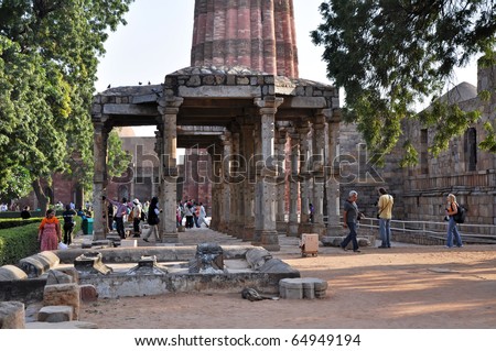 DELHI, INDIA - 24 OCTOBER: An unidentified group of people visit ruins at Qutub Minar in Delhi on October 24, 2009. The Minar was declared a UNESCO World Heritage Site.