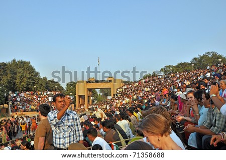 WAGAH BORDER, INDIA - 25 OCTOBER: Visitors of the ceremonial on indo-pakistan border on October 25, 2009. Ceremonial is famous for opening and closing the gate between both states.