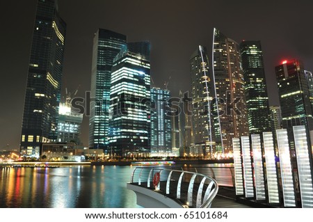 Singapore skyline and river at night