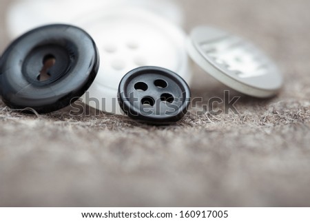 Black and white buttons. Extremely close-up photo with shallow depth of field