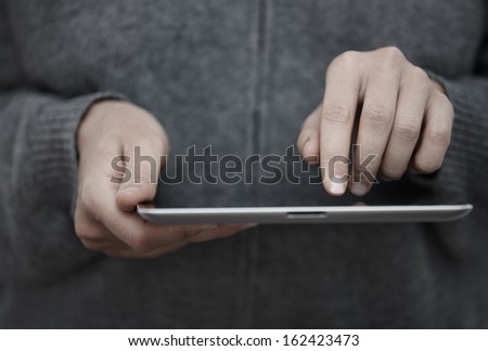 Human hands with tablet PC. Close-up view