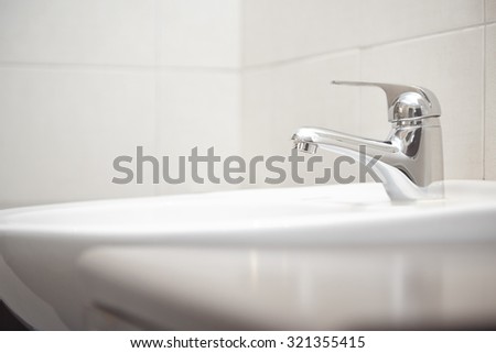 Sink with water tap. Close-up horizontal photo