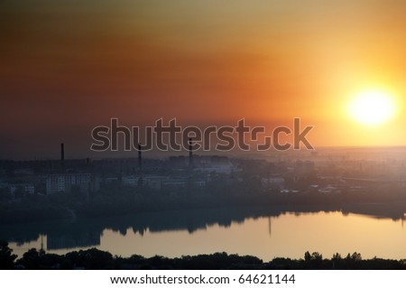 View on the city with industrial tubes during sunset. Natural colors and darkness