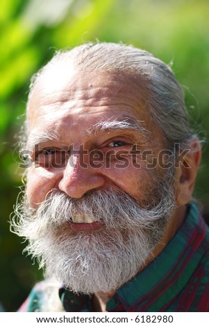 Old Man with a White Beard looking like Real Santa Claus.