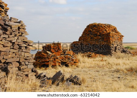 stock-photo-grave-burial-mound-of-ancient-scythians-kazakhstan-63214042.jpg