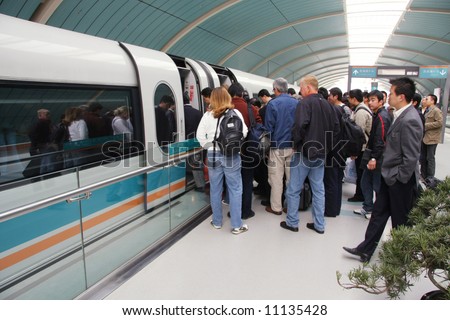 Commuters boarding Shanghai Maglev Train - \'bullet train\' in Shanghai, China