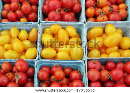 ripe, cherry and grape tomatoes at a farmer\'s market