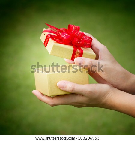 christmas gift box with hand open