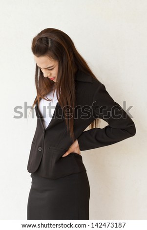 backpain of female business executive, concept of office syndrome with spinal or lower back problem
