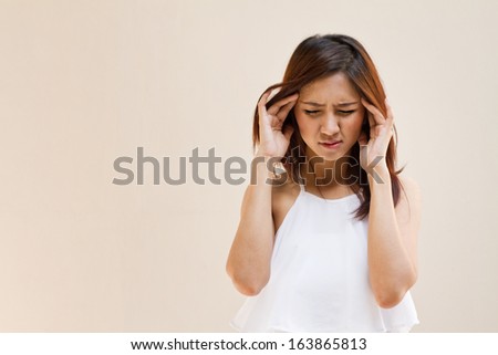 woman with headache, migraine, stress, insomnia, hangover in casual dress with blank space