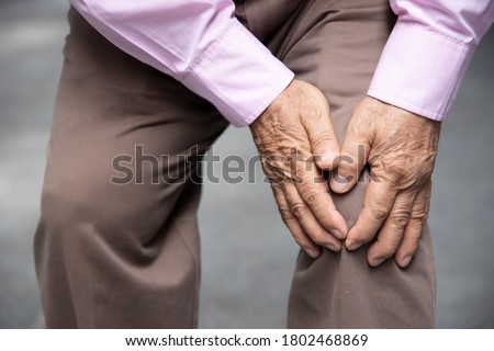sick old senior man suffering from knee pain, knee joint injury, gout, rheumatoid, arthritis, osteoporosis, concept of accessibility or a11y Foto d'archivio © 