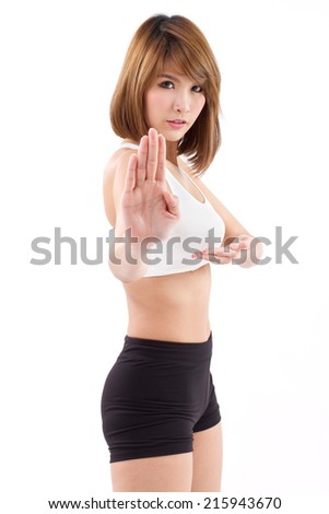 strong female martial artist assuming kungfu fighting stance