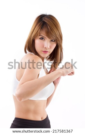 strong sporty woman assuming fighting stance