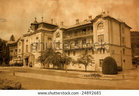 Old hotel in Bardejov, Slovakia. Aged photo effect with scan of old paper as background