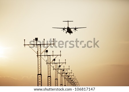 Propeller airplane is landing on Prague Airport, Czech Republic