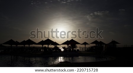 Beach of african hotel resot in the night, light manipulated