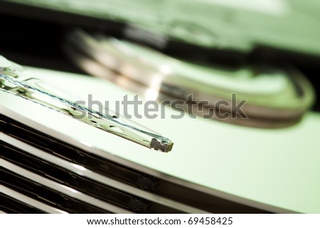 Hard drive disk. Focused on magnetic read write head. Color manipulated.