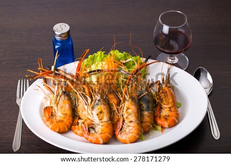 Grilled Shrimp multiple white dish with vegetables.