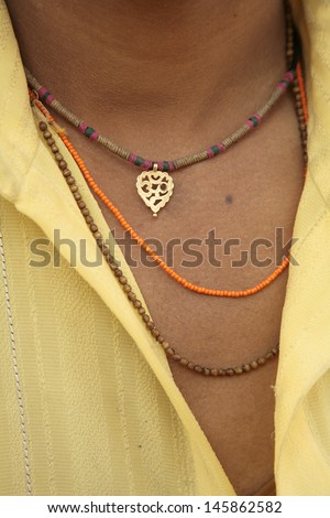 Indian man neck and necklaces