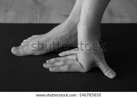 Yoga lesson, foot and hand closeup