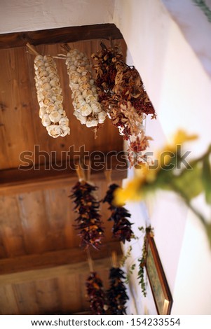 Garlic and withered plants hanging from ceiling