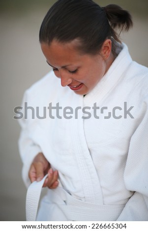 Traditional way to tie a belt; woman in martial art