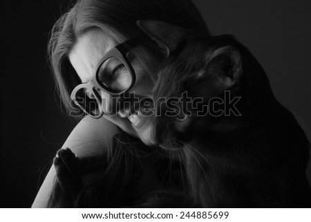 Portrait of happy woman with her cat
