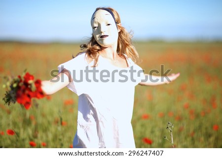Woman in asian mask and white dress whirling outdoors