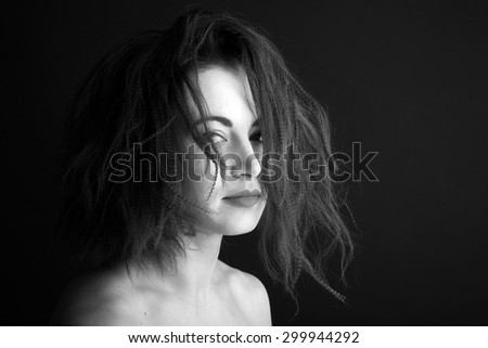 Portrait of a beautiful woman with futuristic hairstyle, monochrome