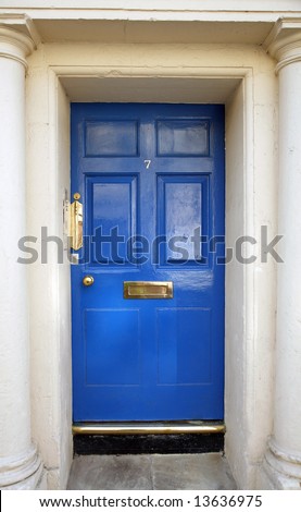 entrance door in an ancient house with columns, blue color