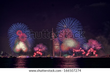 DUBAI, UAE - JANUARY 1: New year celebration with fireworks in Burj Al Arab and Burj Khalifa on January 1,2013 in Dubai, UAE