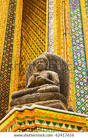 a buddhist statue at the grand palace in bangkok ,thailand