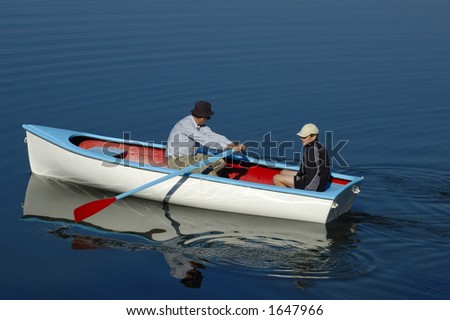 Father and son set off in their rowing boat, out on to the water one calm summer\'s morning