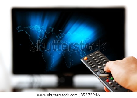 TV LCD set displaying glowing world map. Remote control in man\'s hand. Isolated over a white background.