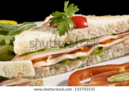 Club sandwich with processed cheese, ham and bell pepper