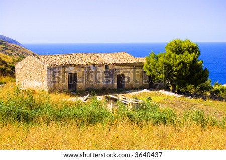 Small italian house on a hillside by the ocean
