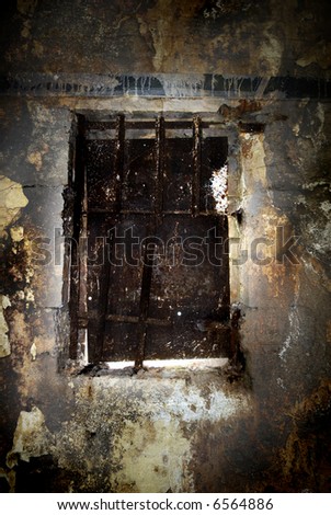 Old grungy window from inside an old war bunker, or old prison cell