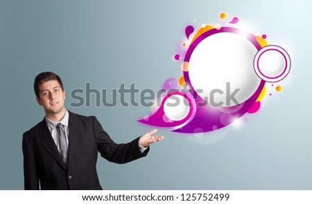 Handsome young man presenting abstract speech bubble copy space