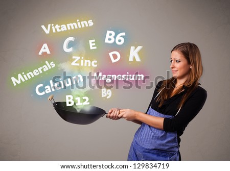 Pretty young woman cooking vitamins and minerals