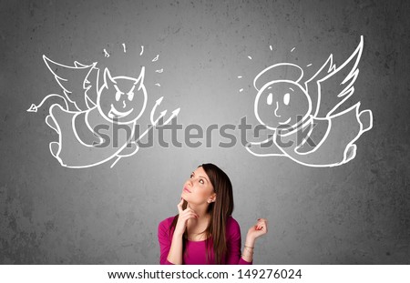 Young woman standing between the angel and the devil drawings