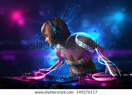 Beautiful disc jockey playing music with electro light effects and lights