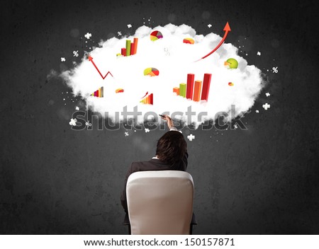 Young businessman sitting in an office chair with colorful charts in a cloud above his head