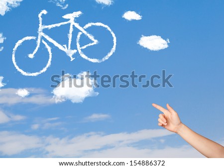 Young hand pointing bicycle clouds on blue sky