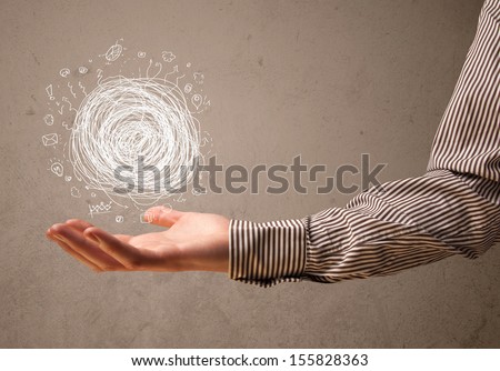 Businessman presenting chaos concept in her palm