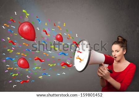 Young girl having fun, shouting into megaphone with balloons and confetti