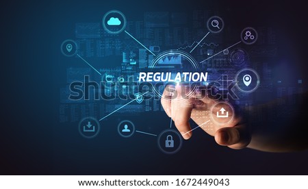 Hand touching REGULATION inscription, Cybersecurity concept Stockfoto © 
