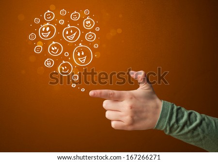 Group of happy hand drawed smile faces coming out of gun shaped hands