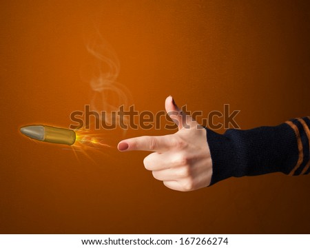 Gun shaped woman hand with bullet coming out of it
