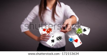 Pretty young woman playing with poker cards and chips