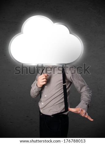 Businessman standing and hiding his head behind an empty cloud